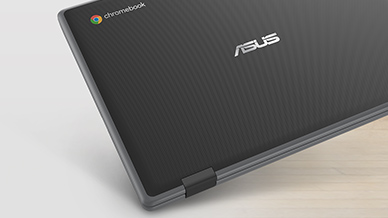 A closed ASUS Chromebook which all edges are covered by a rubber bumper is shown and one of the corner hit the ground without physical damages.